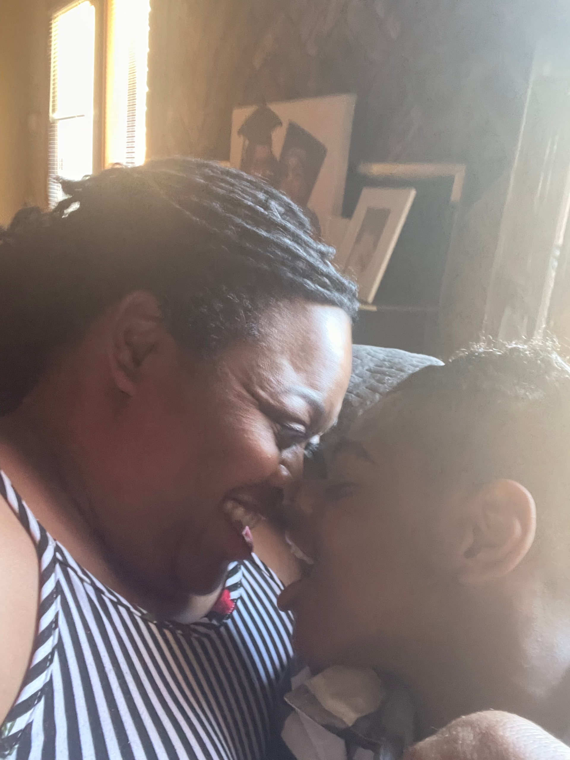 Mom and son sharing a smile; a love and caregiving moment