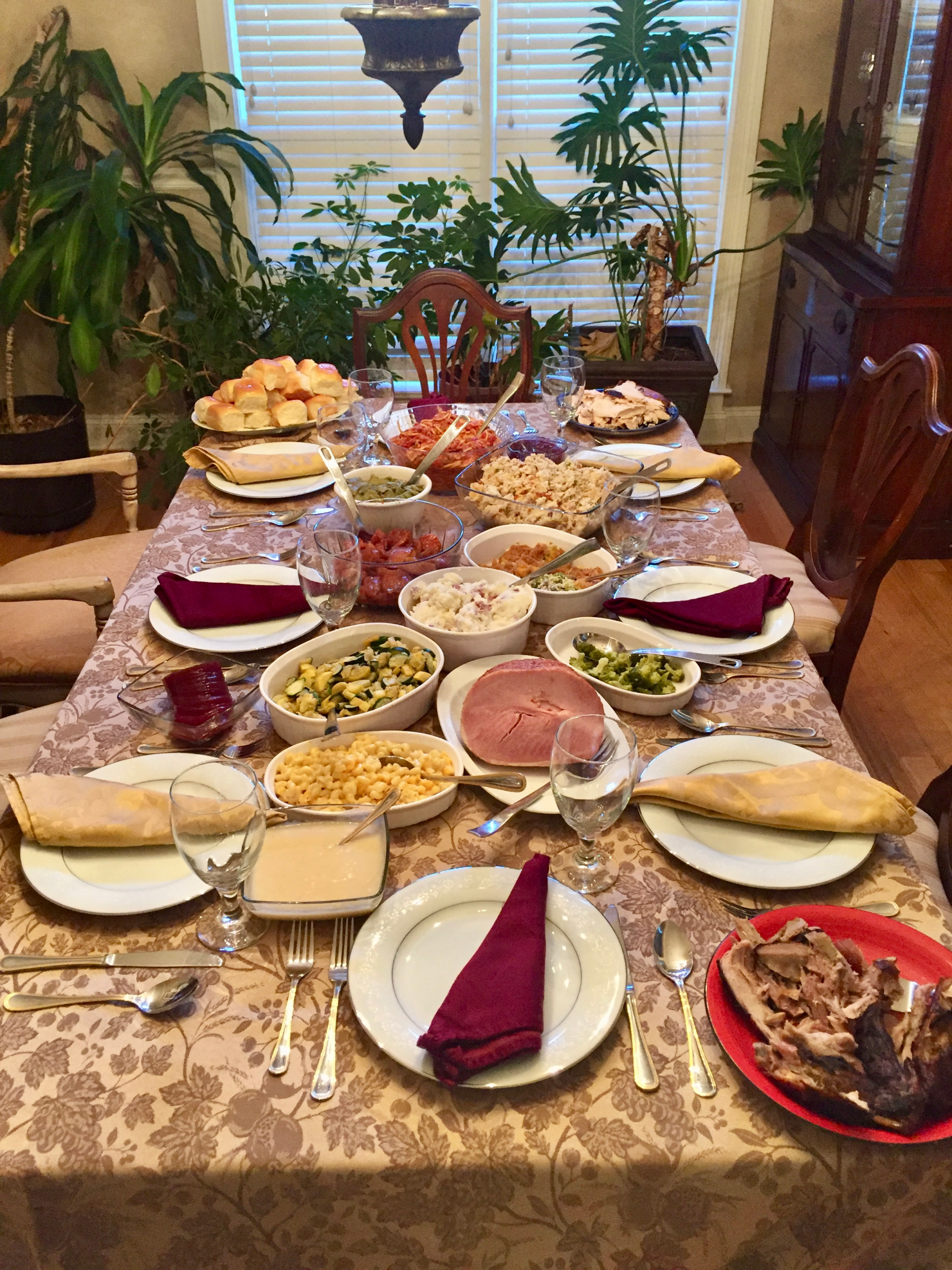 Warm Thanksgiving table with place settings, and gentle fall tones symbolizing caregiving, faith, and gratitude.